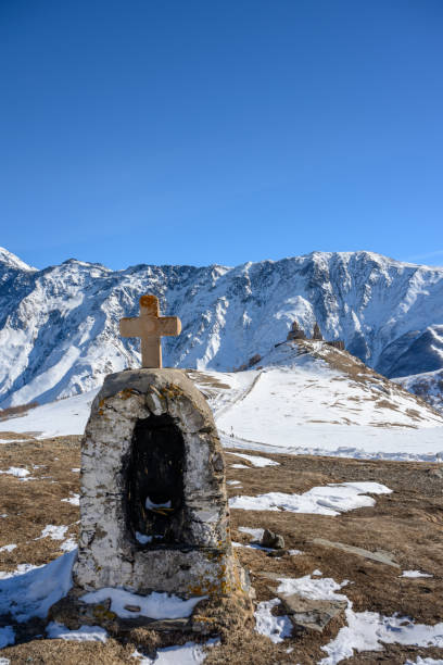 istock Churches and crosses on snowy mountains 2201847638
