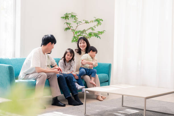 istock Family relaxing in the living room 2201848494