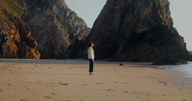 istock A woman runs along the seashore 2201849605