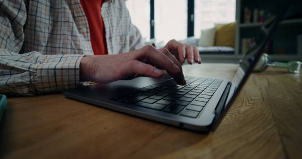 istock Close-up of a woman's hands typing on a laptop 2201851252