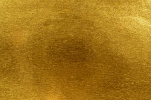 istock Shimmering Gold-Gilded Surface with Textured Finish and Reflection, Background texture 2201851873