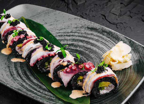 istock Delicious sushi rolls with fresh ingredients served on a stylish plate 2201852377