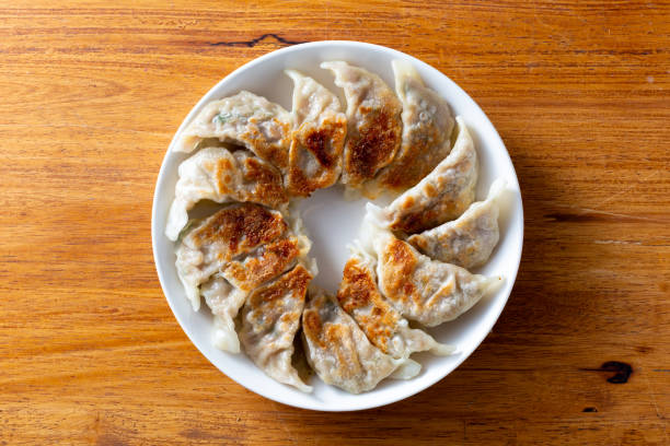 istock pork dumplings on wooden background 2201853133