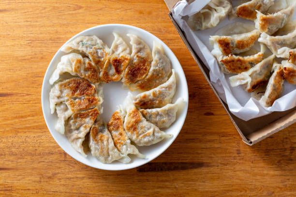 istock pork dumplings on wooden background 2201853146