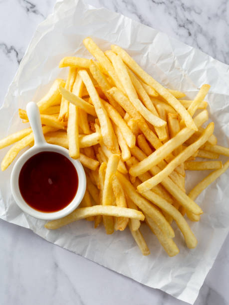 istock french fries on white background 2201853157