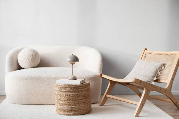 istock Modern interior design. Sofa, chair with pillows and white carpet in a living room 2201853294