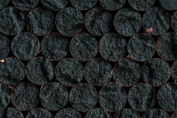 Graphite cores surrounded by a layer of copper, a raw material for the new technology industry as background