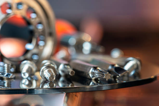 istock Set of bits tool and bolts, installation on metal workshop table 2201853592