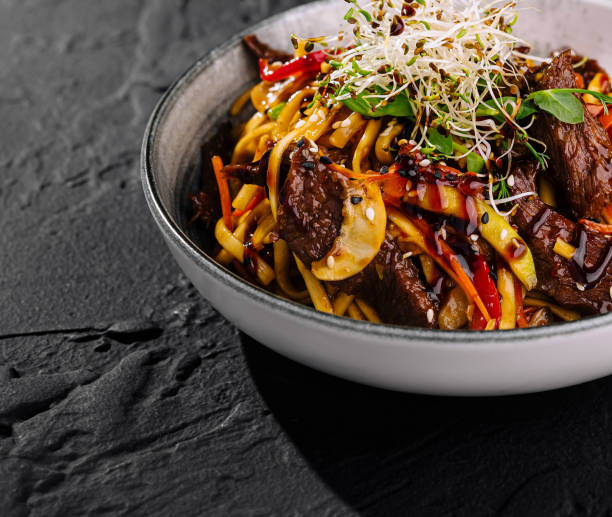 istock Asian beef stir fry with noodles and vegetables 2201854211