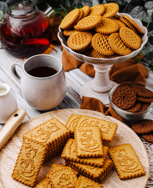 istock Enjoying an afternoon tea with assorted cookies and herbal tea in a cozy setting 2201854687