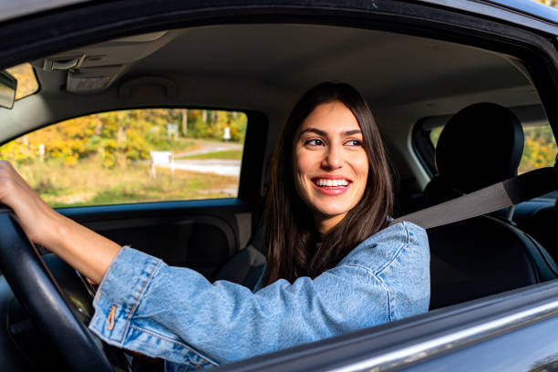 istock Woman driving her car in the mountains 2201856322