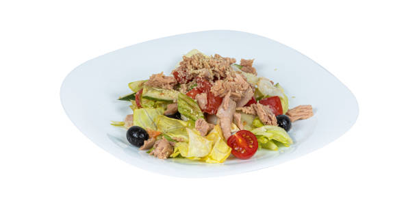 istock A salad with tuna, tomatoes, olives, and lettuce on a plate 2201856327