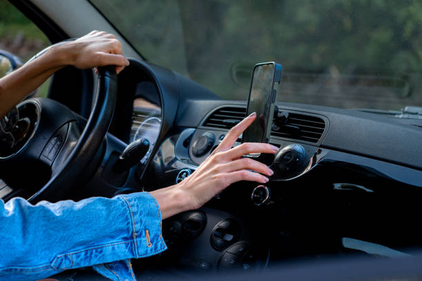 istock Torching a phone as a map in the car 2201856389