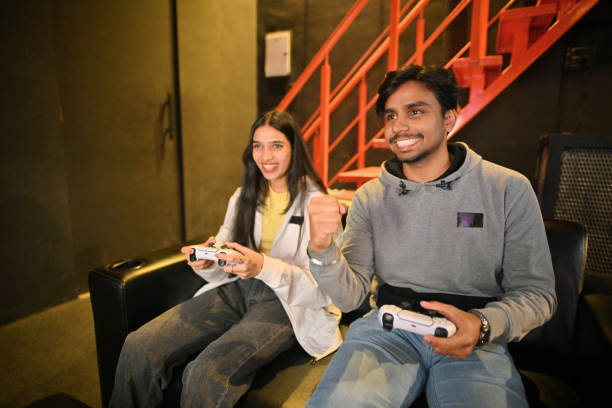 istock Young people gaming at a gaming hub, boy celebrates victory 2201856787