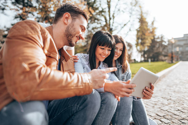 istock friends using the social media outdoors 2201856851