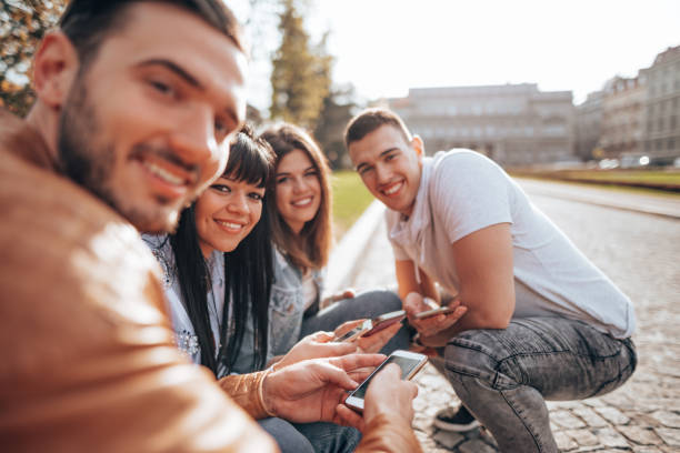 istock friends using the social media outdoors 2201857015