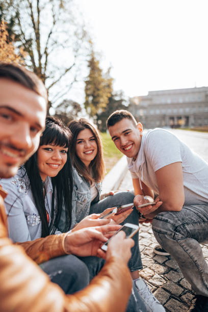 istock friends using the social media outdoors 2201857317