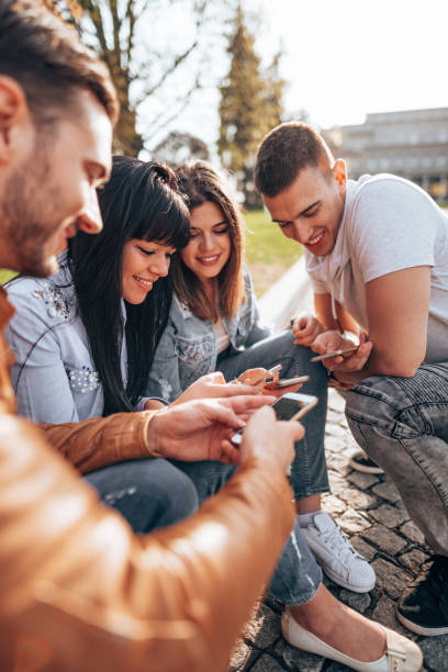 istock friends using the social media outdoors 2201857397
