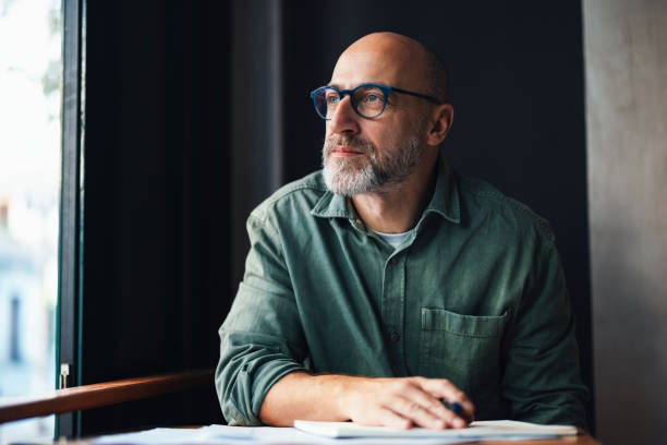 istock Business Man Working Thoughtfully in a Cozy Office Environment 2201858231