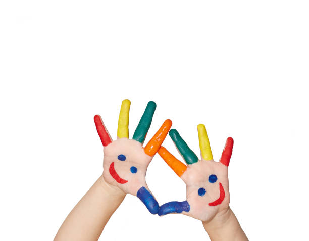 Children's palms cheerfully painted with paint on a white background with copy space. Card for birthday or holiday invitation.
