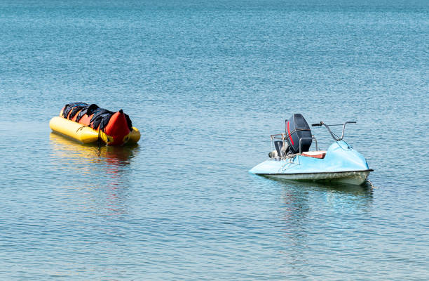 istock Watercraft pull a banana boat on the sea 2201859221