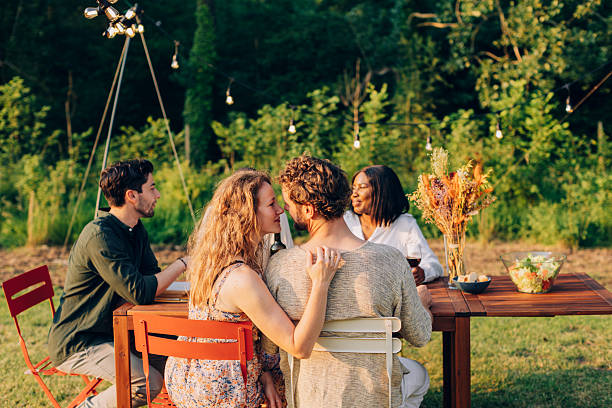 istock Romantic outdoor dinner with friends at sunset 2201859377