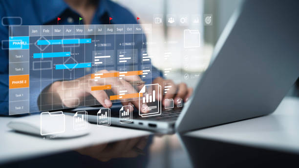istock Project management tool concept. Business people use laptop to manager working projects and update task with Gantt chart schedule to Business plan and progress. Planning software. 2201863890