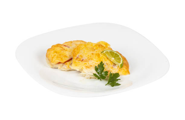 istock A white plate with fried foods and a lime slice for garnish 2201864852