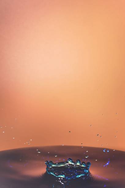 Raindrops in puddle.