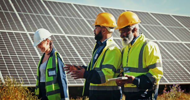 istock People, group or technician with solar panel for photovoltaic, PV discussion or renewable energy. Team, engineer or contractors with tablet, technology or system for eco friendly or alternative power 2201865174