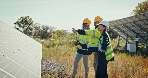 istock Business people, team and pointing with solar panel for photovoltaic, PV installation or renewable energy. Group, engineer or contractors on tablet or technology for eco friendly power in nature 2201865237