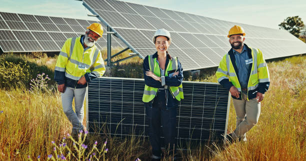 istock Solar panel, portrait and people with engineering, sustainability and electricity maintenance. Inspector, employees or leader with clean energy, teamwork or photovoltaic power grid with cooperation 2201865256