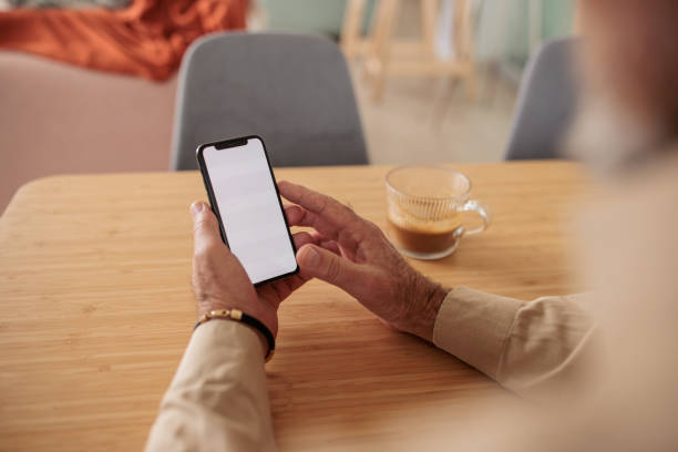 istock Senior man using his phone for online banking at home 2201865520