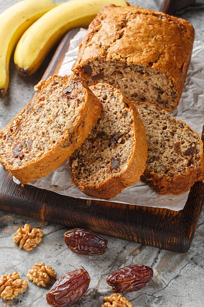 istock Date banana nuts diet bread close-up on wooden board. Vertical 2201866683