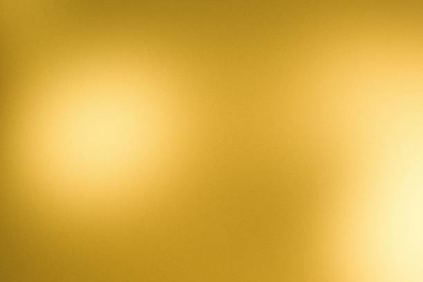 istock Grainy gradeint golden diffused light gold bronze color aura plain blurred abstract background with noise texture 2201867166