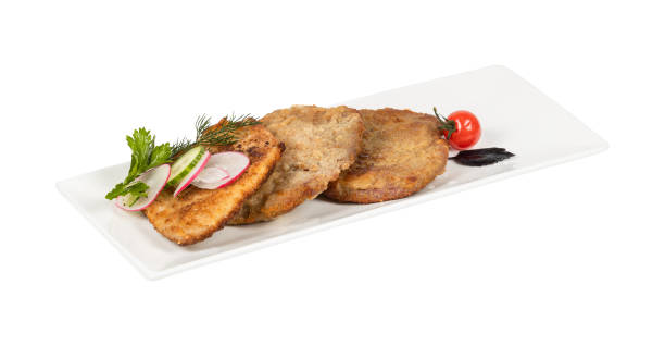 istock A white plate with fried food and vegetables on a white background 2201867426