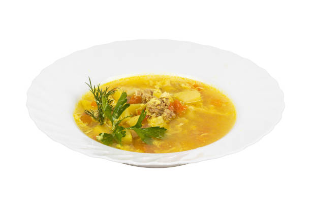 istock A bowl of meatball soup with vegetables on a white background 2201867771
