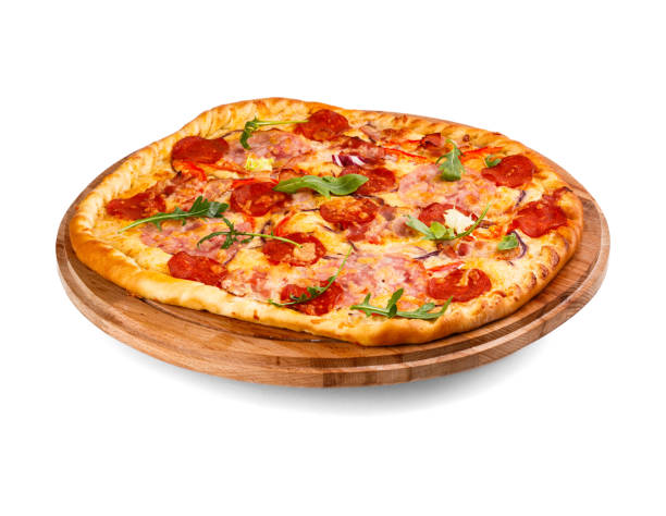 istock A pepperoni pizza is now on a wooden cutting board for serving 2201867829