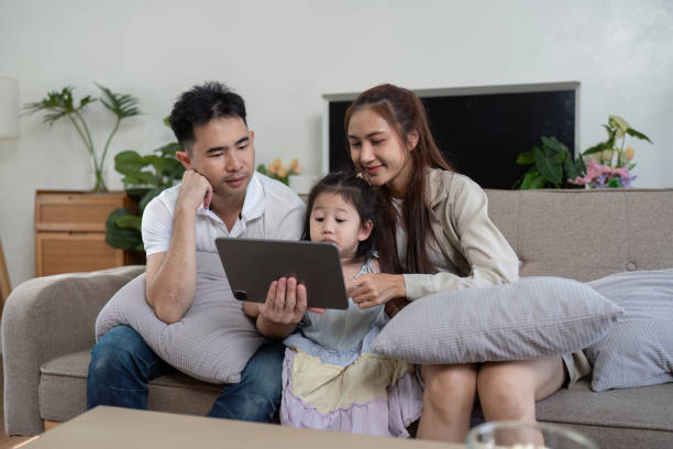 istock Family bonding over a tablet, sharing a moment of joy and learning 2201868497