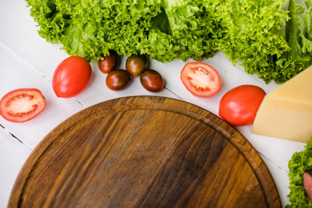 istock Vegetables on wood. Organic vegetables on a wooden table. 2201869379