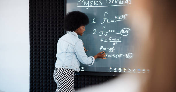 istock Education, student and woman with formula, smart board and revision for exam in classroom or online. Learning, pupil and person in university for knowledge, digital or writing for practice of physics 2201869885