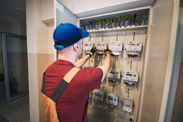 istock Electrician working on a modern electricity power meter station in a building. 2201871466