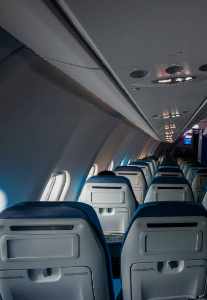istock Inside a nearly empty aircraft cabin on a tranquil flight in early morning light 2201873451