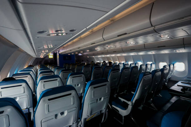 istock Interior view of an airplane cabin showcasing empty seats during a late evening flight 2201873460