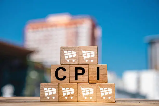 CPI, consumer price index symbol. Wooden blocks with words CPI, consumer price index on dollar bills with a calculator, coins. Business and CPI, Business and consumer price index concept. CPI, consumer price index symbol. Wooden blocks with words CPI, consumer price index on dollar bills with a calculator, coins. Business and CPI, Business and consumer price index concept.