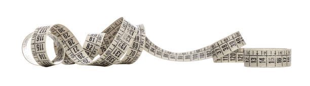 istock Measuring tape coiled and showing different measurement numbers 2201875029