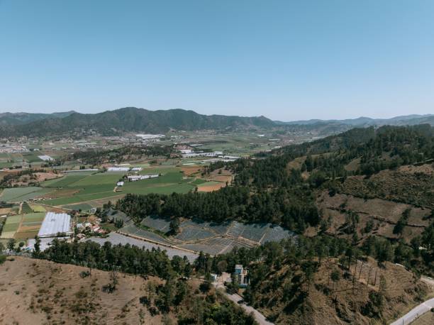 istock Aerial view of agricultural fields and forested hills. 2201875355