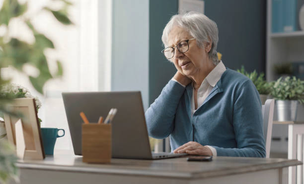 istock Senior woman having neck pain 2201877083