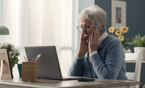 istock Senior woman struggling with technology 2201877220