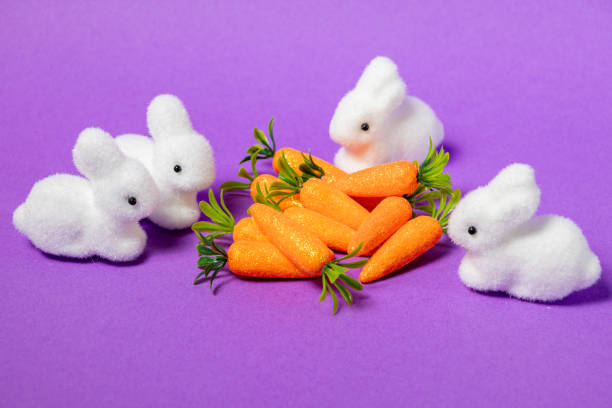 istock easter decoration with speckled hanging eggs on a tree branch against a neutral beige background, creating a rustic and minimalistic holiday atmosphere 2201878422